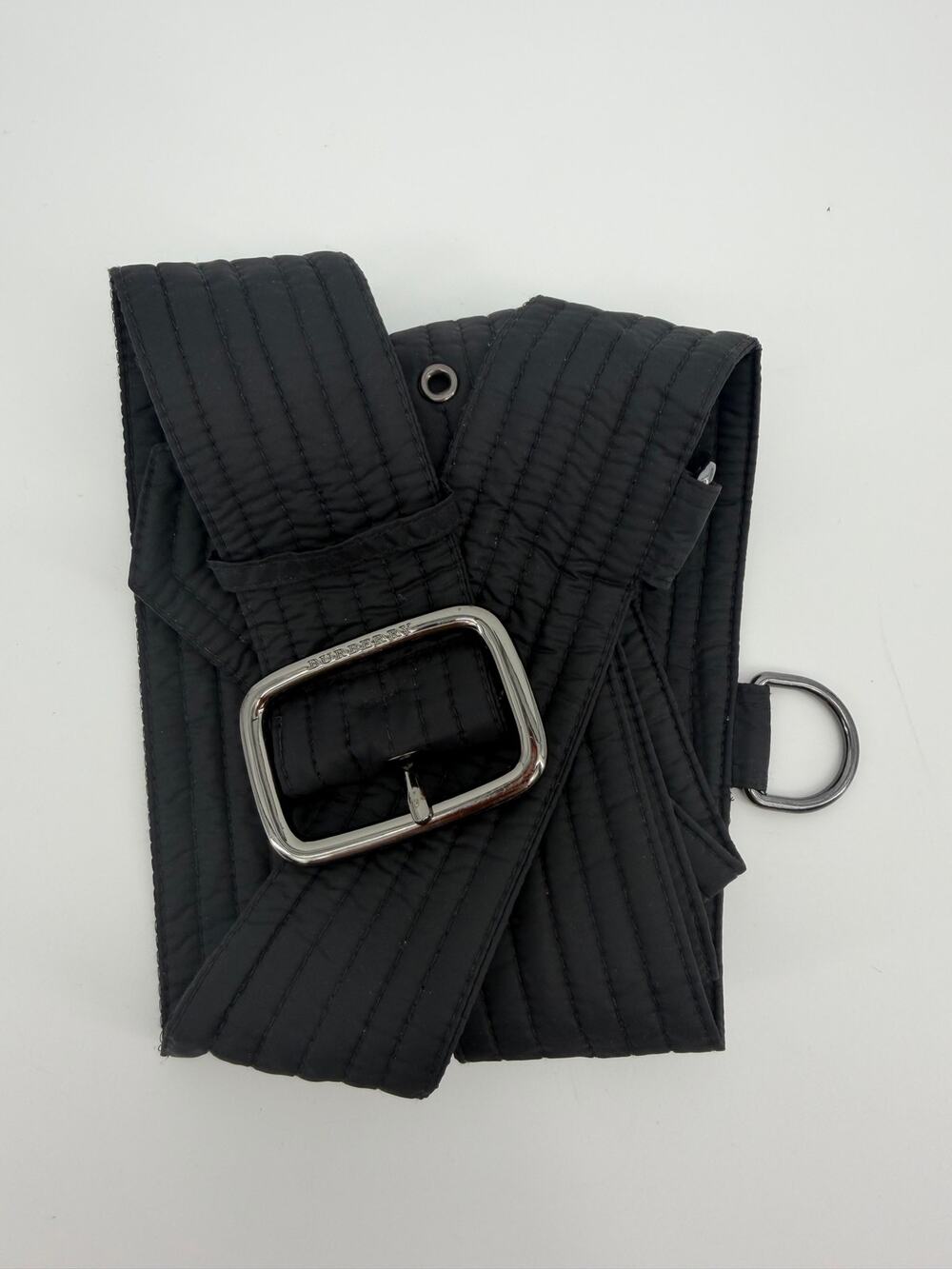 black Burberry quilted trench coat belt featuring a silver-tone buckle